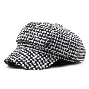 Classic black and white houndstooth newsboy cap with gold threads for autumn and winter fashion