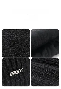 Detail of warm black knit beanie featuring plush fleece lining and metal sport logo tag