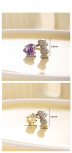 Detailed view of heart-shaped zircon piercing with bowknot design and dimensions