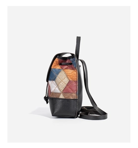 Detail of multi-color quilted leather backpack with drawstring and flap closure