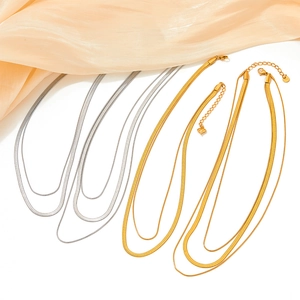 Double-layer stainless steel snake bone bracelet in gold and silver with silk accent