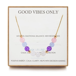 Beaded necklace with natural stones and gold spacers in a kraft gift box with card