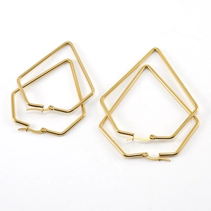 Golden stainless steel geometric pentagon and hexagon hoop earrings set on white background