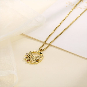 18K gold butterfly hollow pendant necklace with multi-color zircon stones on beige background