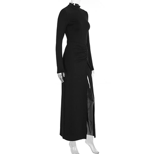 Detail of ruched waist design and high side slit on black long sleeve maxi dress
