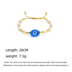 Detailed view of the Evil Eye pearl bracelet with 26cm length and 7.5g weight specs