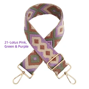 Detail of colorful geometric diamond pattern woven strap with gold metal buckles