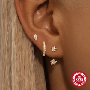Gold S925 sterling silver evil eye and star earring set with zircon accents on model