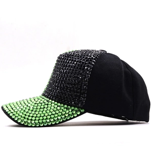 Detail of neon green and black rhinestones on a stylish baseball cap for parties