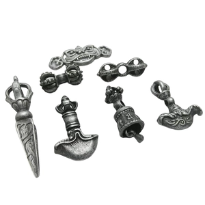 7Pcs vintage alloy metal Tibetan Buddhist ritual vajra and bell charms on white background
