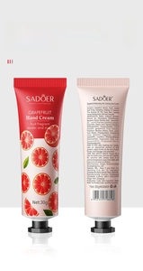Macro-opname van SADOER Grapefruit handcrème 30g tubes met het verloop van de verpakking