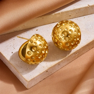 French style hollow ball earrings in 18k gold finish with crater texture on stone surface