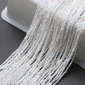 Macro detail of 2mm iridescent faceted glass beads with AB coating for DIY jewelry
