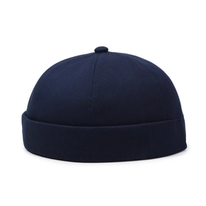 Minimalist navy blue cotton docker hat with six-panel construction and a rolled brim