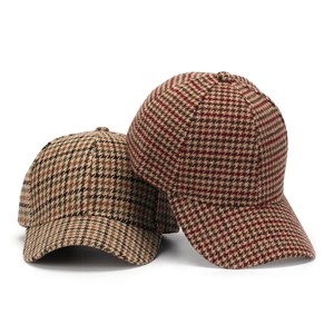 Vintage houndstooth pattern baseball cap in warm earth tones for a stylish autumn look