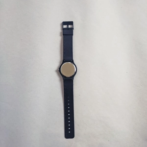 Detailed back view of quiet exam watch featuring silver metal case and black rubber strap