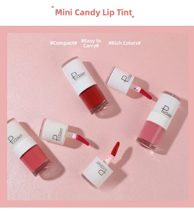 Detailed close-up of mini candy lip glaze with transparent bottles and soft brush applicators
