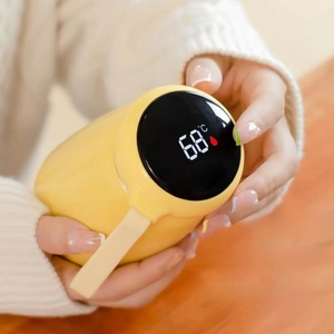 Macro shot of 320ml yellow smart thermos featuring an LED temperature display lid