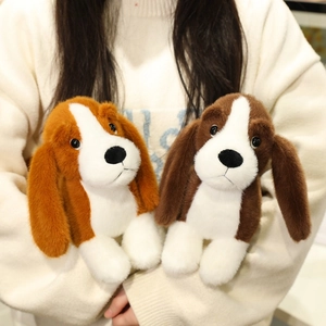 Soft plush dachshund puppy dolls in brown and white shown in a cozy embrace