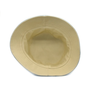Detail showing high-quality stitching on the brim and beige lining of this bucket hat