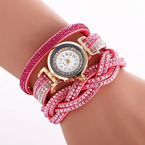 Pink multi-layer woven rhinestone bracelet watch with a gold-tone dial on a model wrist