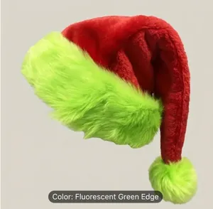 Detail of red plush Christmas hat with neon green cuff and fluffy white pom-pom