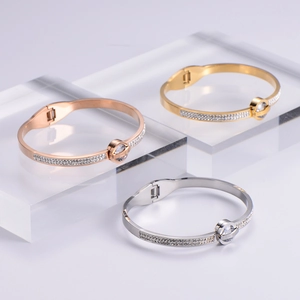 Minimalist Roman numeral spring bracelet with diamonds in gold, rose gold, and silver finishes