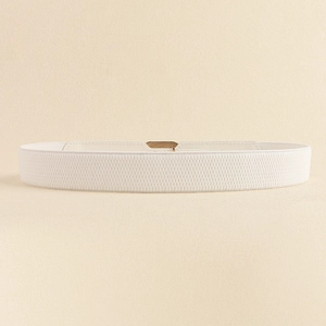 Detail of white elastic waist belt with textured stretch band and gold-tone metal buckle