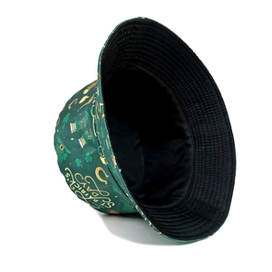 Reversible St. Patrick's Day bucket hat with green clover print and black lining