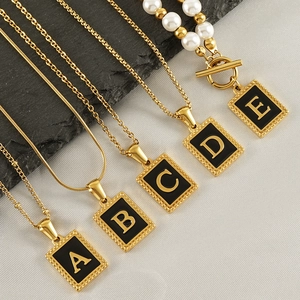 Gold stainless steel necklaces featuring black rectangular letter A to E pendants