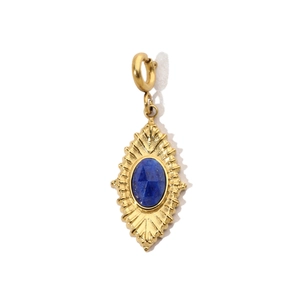 Detailed view of a gold-plated stainless steel pendant with an oval blue gemstone inlay
