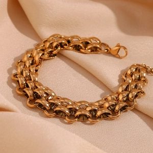 Macro shot of 18K gold plated double-row woven chain bracelet with lobster clasp