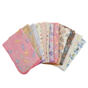 Soft flannel pet blankets with paw prints and bone patterns in multiple colors