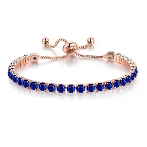 Detail of rose gold tennis bracelet with dark blue crystals and adjustable slide clasp