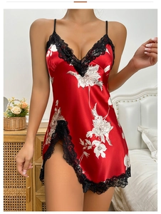 Detail of red floral satin nightgown with black lace trim and sexy side slit design