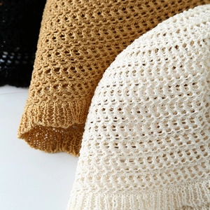 Hollow knit bucket hats in beige, tan and black showing delicate crochet texture