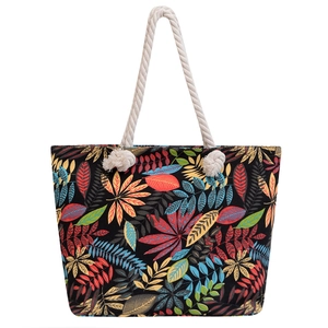 Ethnic canvas tote bag with colorful leaf patterns and white braided rope handles