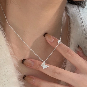Elegant 925 sterling silver butterfly choker necklace on model with double charms