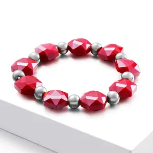Bohemian beaded elastic bracelet featuring faceted red crystals and polished steel beads