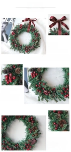 Close-up of artificial pine wreath with red berries, pinecones and a burgundy bow