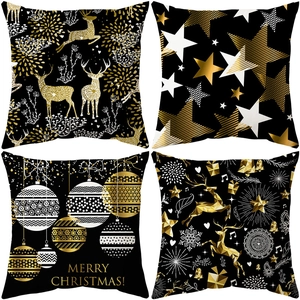 Set of 4 Christmas pillow covers with gold reindeer and tree motifs on black fabric