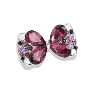 Bowtie brooch featuring purple teardrop crystals and pink zircons on silver base