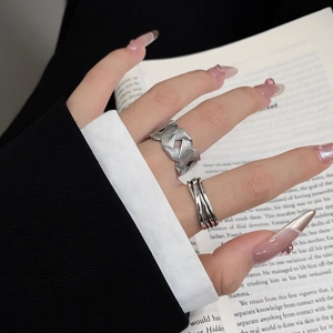 Detail view of S925 sterling silver braided ring and layered bands in vintage style