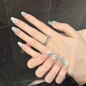 3D floral relief press-on nails with blue cat-eye gradient and pearl accents