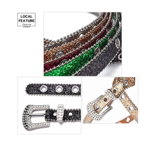 Macro shot of y2k sequin belts with rhinestone buckles and metal grommet details