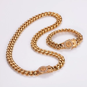 Close-up of golden Cuban chain set with lion head pendant and sparkling rhinestones