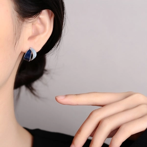 Elegant two-tone blue French style hoop earrings shown on model with polished finish