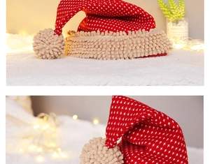 Detail of red knit Christmas hat with white cross patterns and beige chenille trim