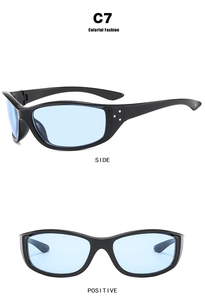 Detail view of black cycling sunglasses with blue lenses and silver stud accents