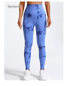 Detail view of high waist yoga leggings featuring a blue tie-dye pattern and seamless fabric